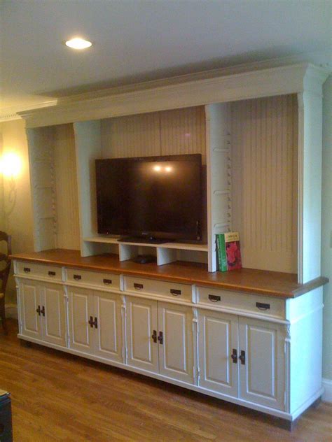 Try using a vintage pine armoire to hold a tv or other electronics. Custom Pine TV Cabinet http://europeanantiquepine.com