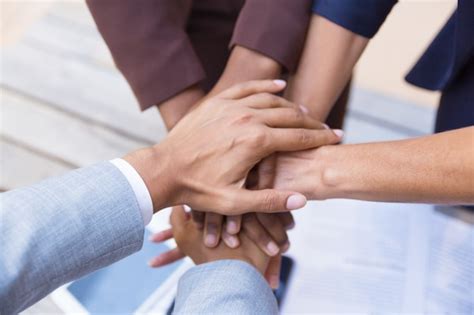 Business Team Putting Their Hands Together Photo Free Download
