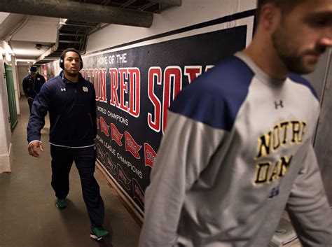 Players Arrive Through The Red Sox Dugout Tunnel Photos Boston College Vs Notre Dame Espn