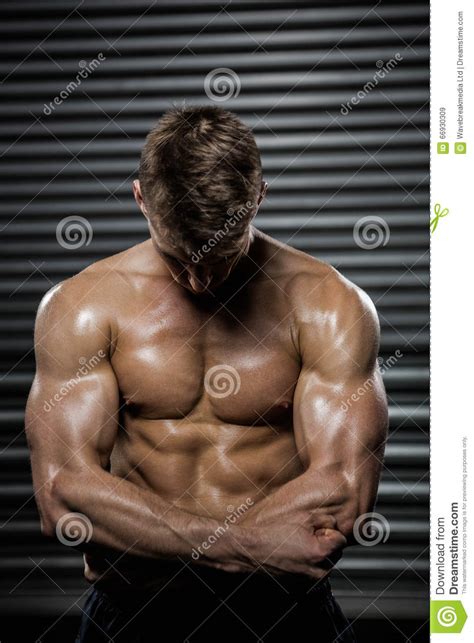 Shirtless Man Flexing Biceps Stock Image Image Of