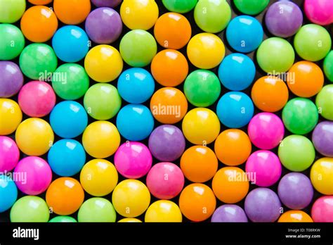 Pile Of Colorful Sweet Candy Chocolates Coated Background Colourful