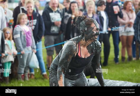 Woman Standing Covered In Mud At A Mud Wrestling Contest At The Lowland