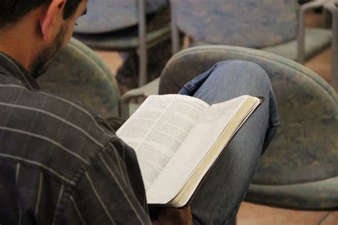 Free Stock Photo Of Man Reading Bible In His Lap