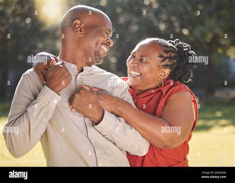 Happy Affectionate Mature African American Couple Sharing An Intimate Moment Outside At The Park