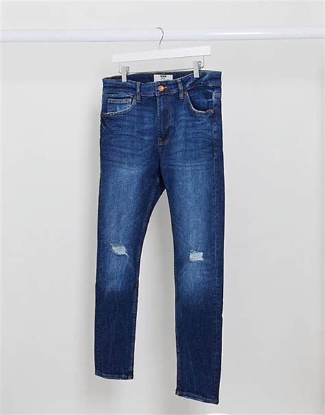 Bershka Super Skinny Jeans With Knee Rip In Mid Blue Asos