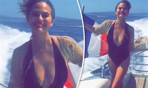 Chrissy Teigen Flaunts Plenty Of Cleavage As She Sizzles In Plunging
