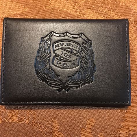 Put your pba card/cards between your drivers license & registration (thats where all mine are ) and i have a family shield pinned on my ins paperwork. Wallet - Gold Card - Logo | PBA Local 105