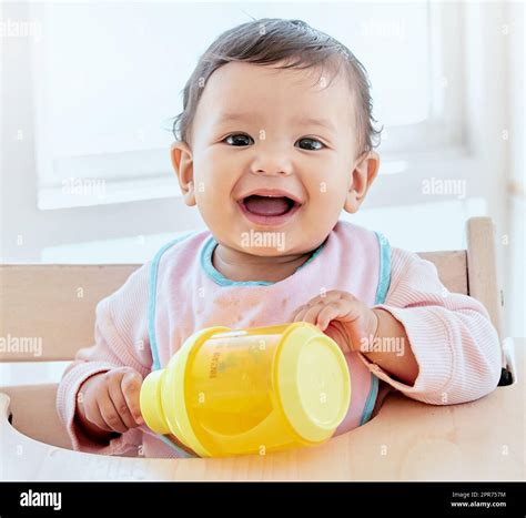 In The Mood For Play Shot Of A Sweet Baby Girl Drinking A Bottle At