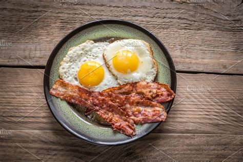 Fried Eggs With Bacon Stock Photo Containing Bacon And Basil High