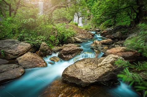 Amazing Waterfall In Colorful Forest Stock Photo Containing Sunlight