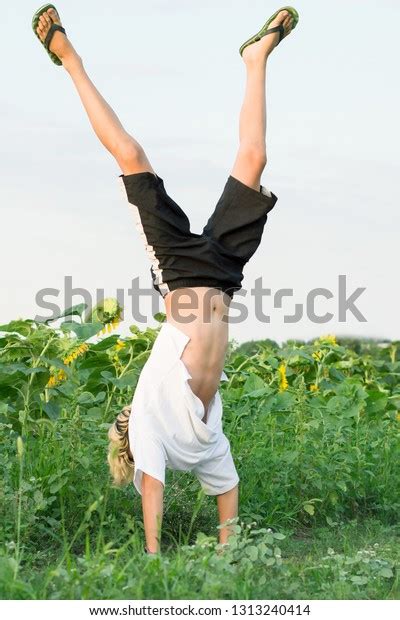 Teenager Doing Handstand Outdoors Energetic Boy Stock Photo Edit Now