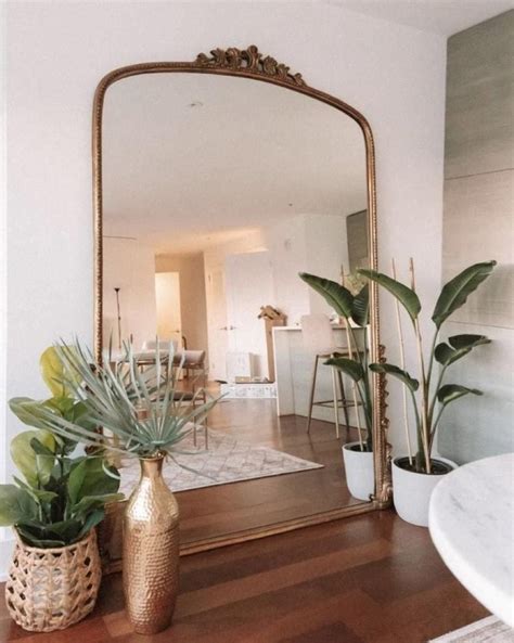 make a dark room feel brighter with these design hacks large mirror