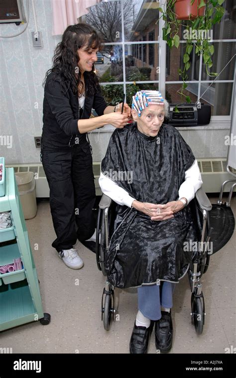 Senior Elderly Woman Has Hair Cut Shampoo Color And Permanent Done By A