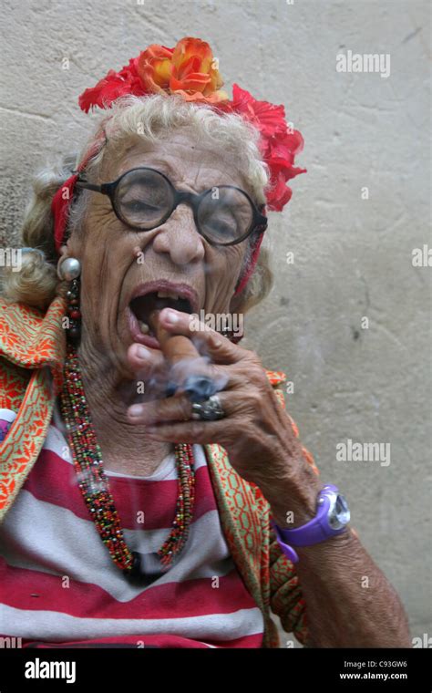 Eccentric Old Cuban Woman Smoking Cigar In The Historical
