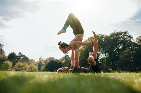 Couple Doing Acro Yoga In Park Stock Image Image Of Male Grass 81226767