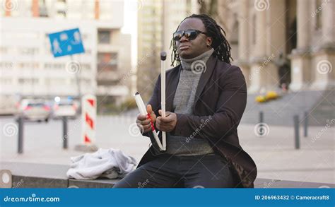 Blind African American Black Man With Sunglases Opening His Walking