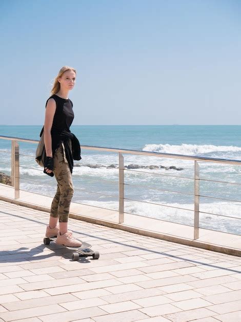 Premium Photo A Beautiful Blonde Girl On Skateboard In Summer Hot Day