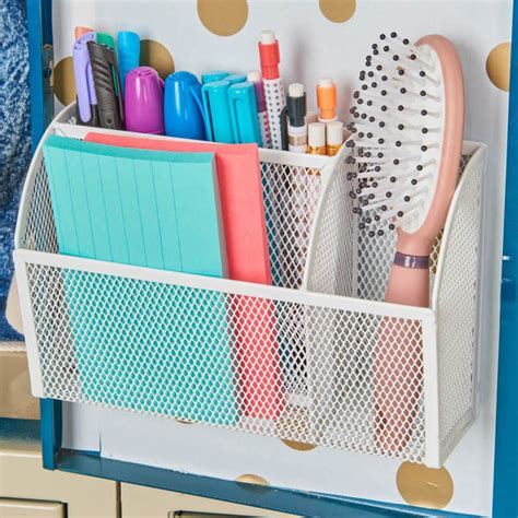 An Organized Desk Organizer With Polka Dot Wallpaper And Gold Dots On