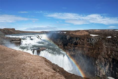 Scenic Cascades Of Gullfoss Waterfall In Golden Circle Against Blue Sky