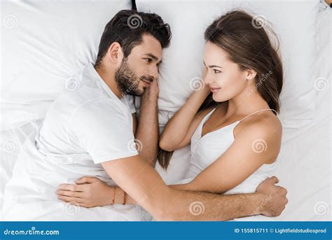 Smiling Couple Hugging In Bed And Looking Stock Image Image Of