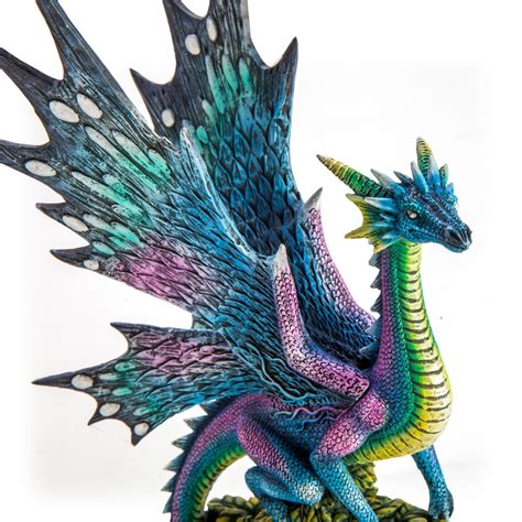 Metallic Rainbow Dragon on Leafy Stones Figurine - Carolina Trading