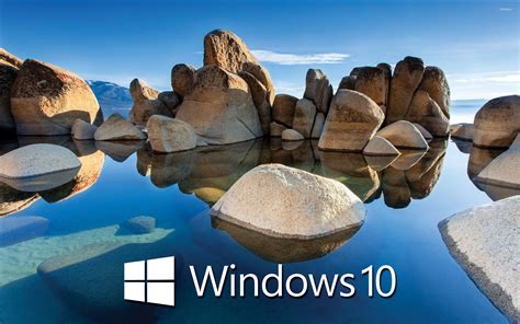 Windows 10 White Text Logo On The Rocky Lake Wallpaper Computer
