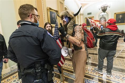 Mr chansley, who calls himself the qanon shaman, is allegedly the man pictured. More suspects charged in storming of US capitol by pro ...