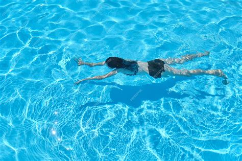 Premium Photo Young Woman In Bikini Swimming Underwater In An Outdoor