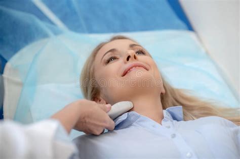 Woman During Ultrasound Examination Of The Neck Stock Photo Image Of