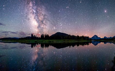 Photo Of Milky Way Galaxy Mountains And Body Of Water Nature