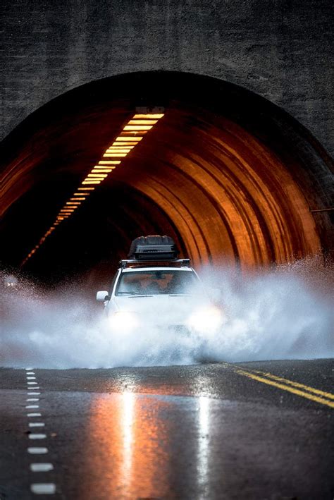 Car Driving Through Snow In A Tunnel