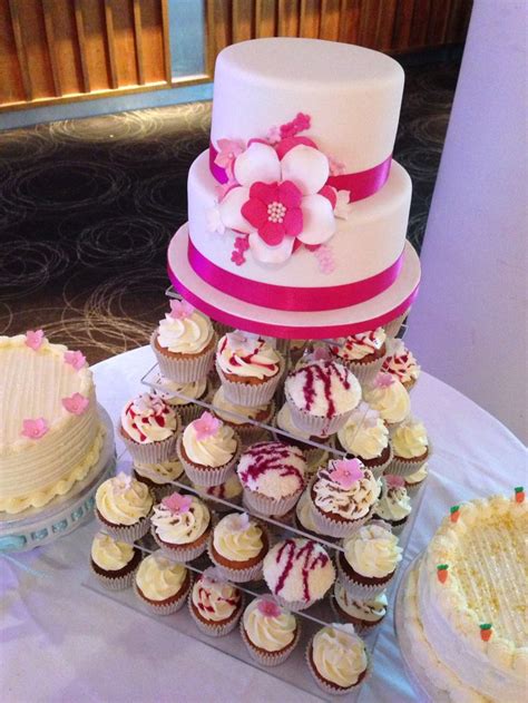Cupcake Tower Topped With 2 Tier Wedding Cake Decorated With Sugarpaste