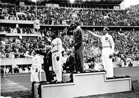 jesse owens winning a gold medal at the summer olympics 1936 r davesofhistory