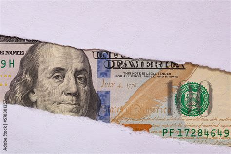 100 Us Dollar Banknote In Torn Paper Hole Stock Photo Adobe Stock