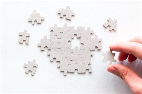 Businessman`s Hand Assembling Pieces Of A Puzzle Stock Photo Image Of