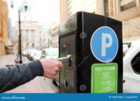 Man Is Paying His Parking Using Credit Card At Parking Pay Station Terminal Stock Photo Image