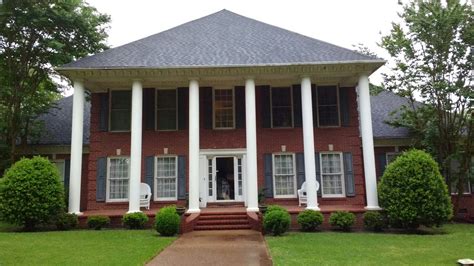Southern Colonial Traditional Red Brick Two Story Mansion Pointy Pyramid Hipped Roof Tall