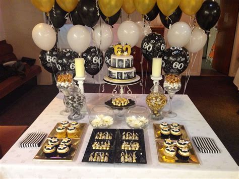 Delicious birthday cupcake on table on bright background. My 1st Dessert Table in Black, White & Gold | Tortas