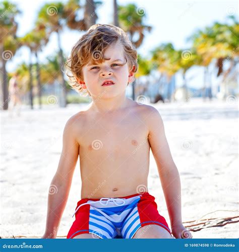 Adorable Active Little Kid Boy Having Fun On Miami Beach Key Biscayne