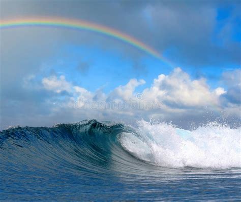 Ocean Wave In Tropical Paradise And Rainbow Stock Photo