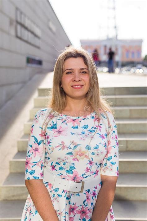 Portrait Of A Beautiful Young Caucasian Blonde Cheerful Girl Outdoor Summer And Vacation