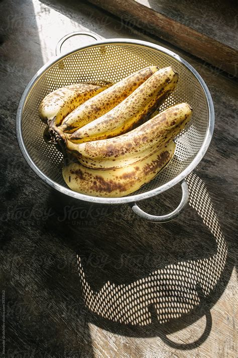 Ripe Bananas On A Table By Stocksy Contributor Alexander Grabchilev