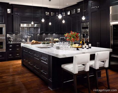 To achieve a sleek and modern look, mix shades of black, blue, and gray throughout the kitchen. 153 Traditional and Modern Luxury Kitchens - Pictures
