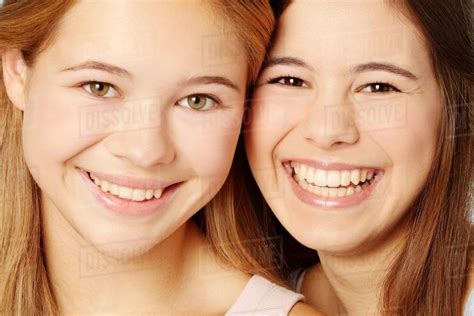 Close Up Of Teenage Girls Smiling Faces Stock Photo Dissolve