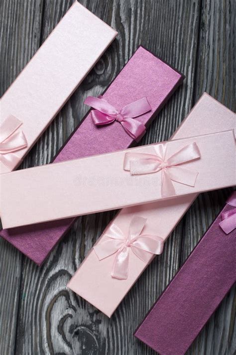 Cardboard Boxes With Ts Pink And Lilac Decorated With Ribbon Bows