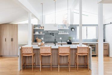 Contemporary kitchen features white shaker cabinets paired with grey and white countertops and a gray subway tiled backsplash from daltile. Gray Backsplash: Kitchen Ideas and Inspiration | Hunker