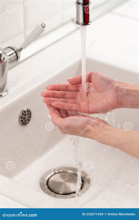 Woman Washing Hands In Fresh Water From Crane In Bathroom Cleanliness