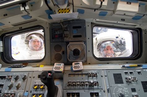 Esa Spacewalkers Look Through Shuttles Aft Flight Deck Windows