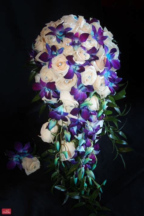 white roses blue purple dendrobium orchids cascading bridal bouquet cascading bridal bouquets