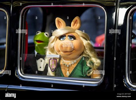 Miss Piggy And Kermit The Frog Arriving At The Premiere Of Muppets Most